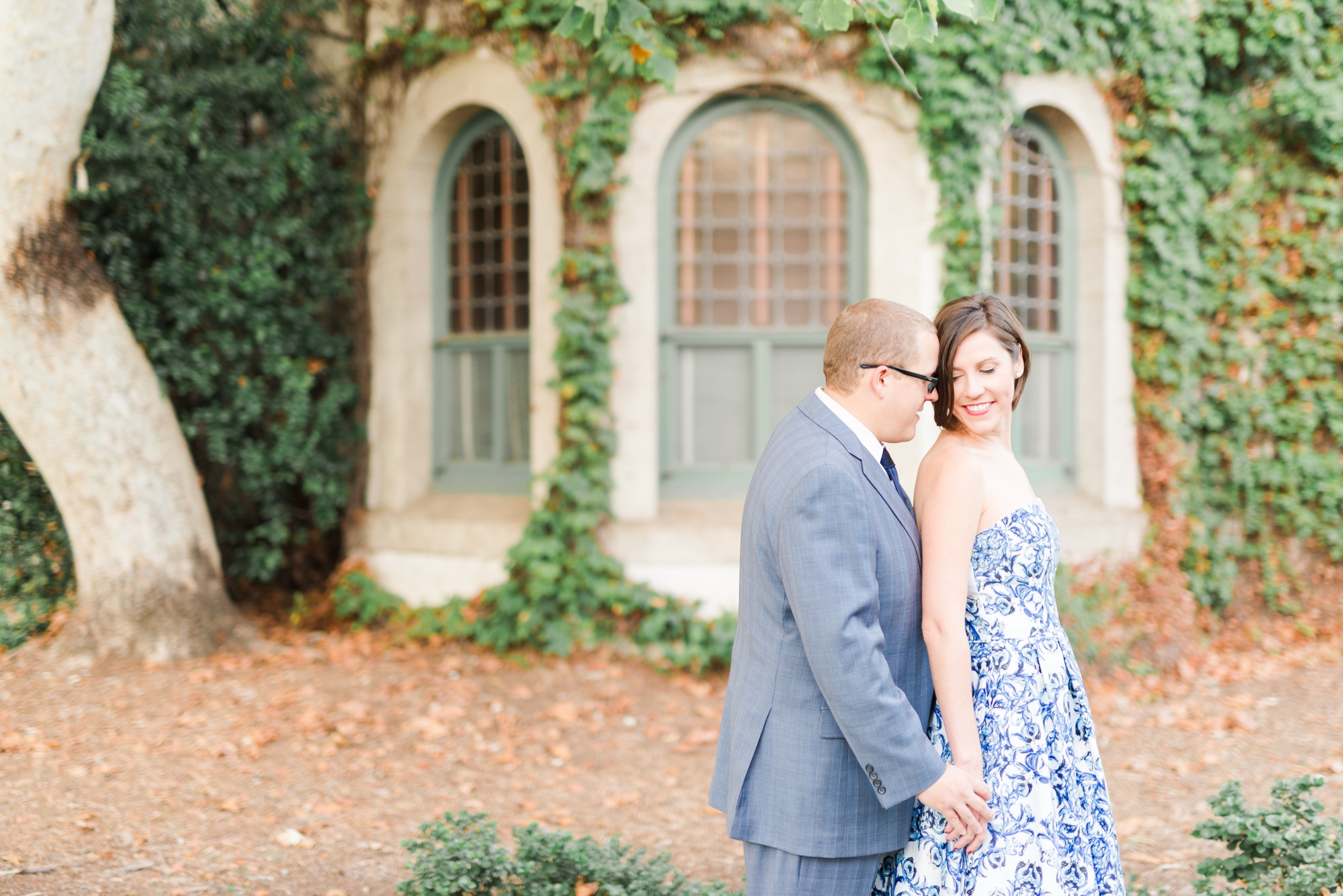 engagement photos with large windows and vineyards