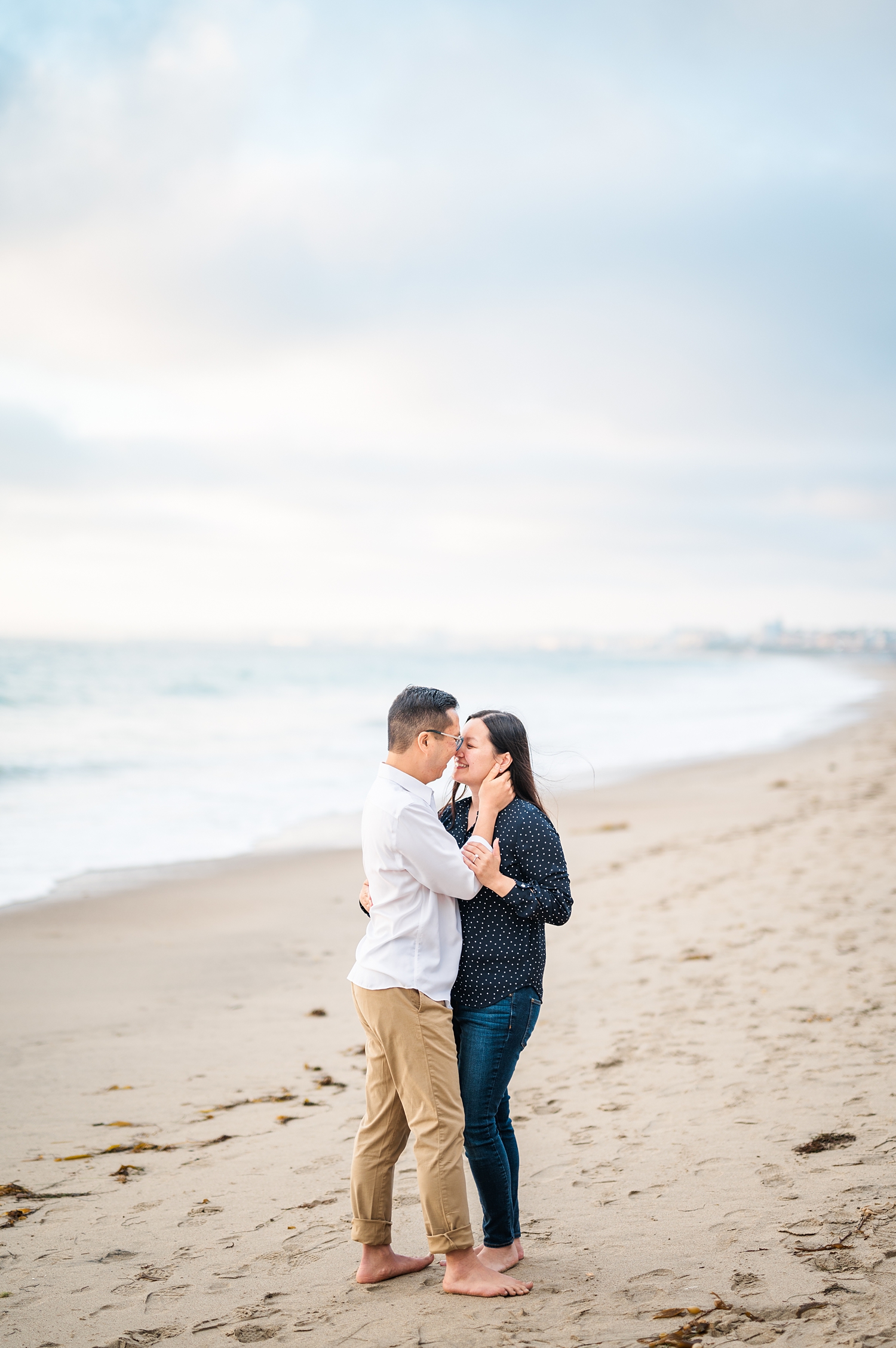 Beach Engagement Session with beautiful clouds and sunset -32.jpg