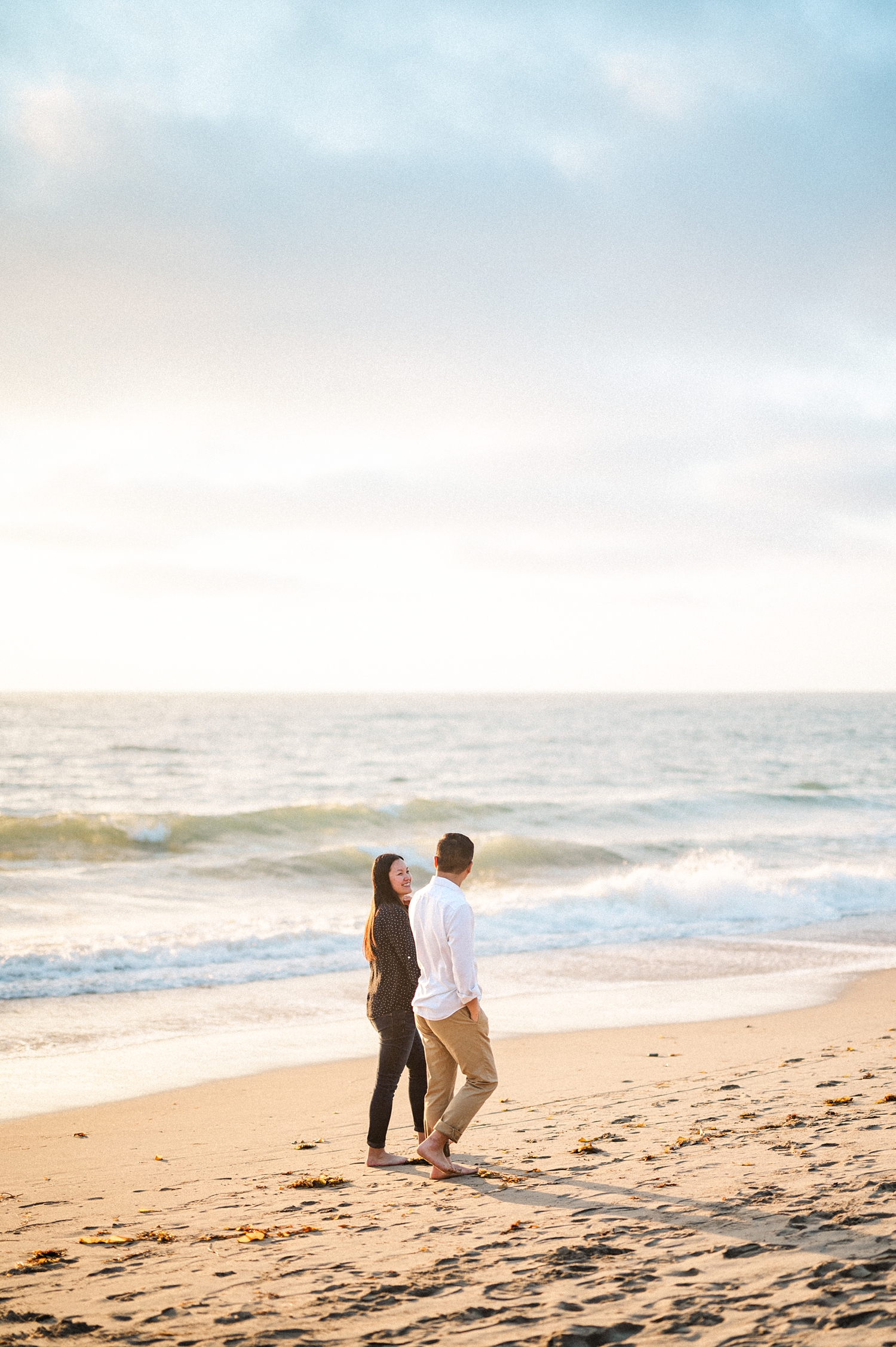 Beach Engagement Session with beautiful clouds and sunset -46.jpg